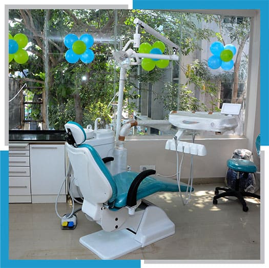 Dental clinic in Gowrivakkam with dental chair decorated with balloons, trees in the background